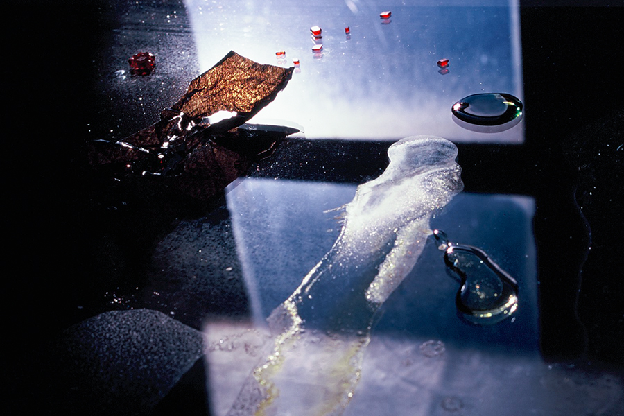 Close-up of liquid and solid materials on the glass-topped table