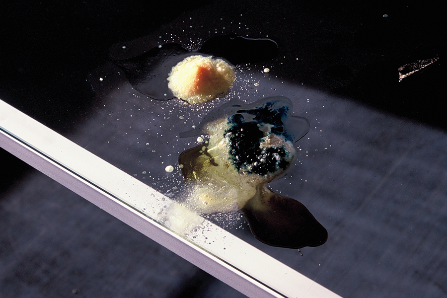 Close-up of reactive materials on the glass-topped table