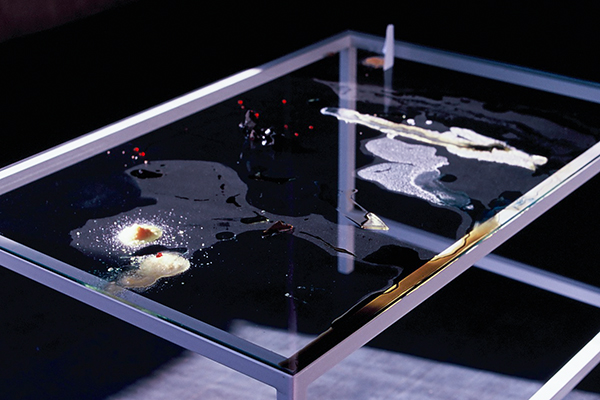 The glass-topped table seen from above at an angle