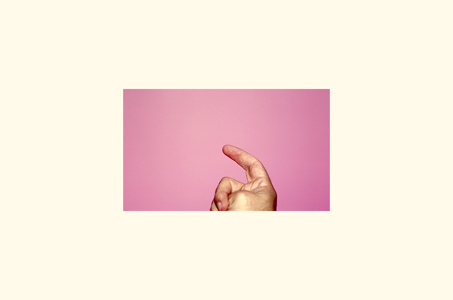 A hand against a pink background